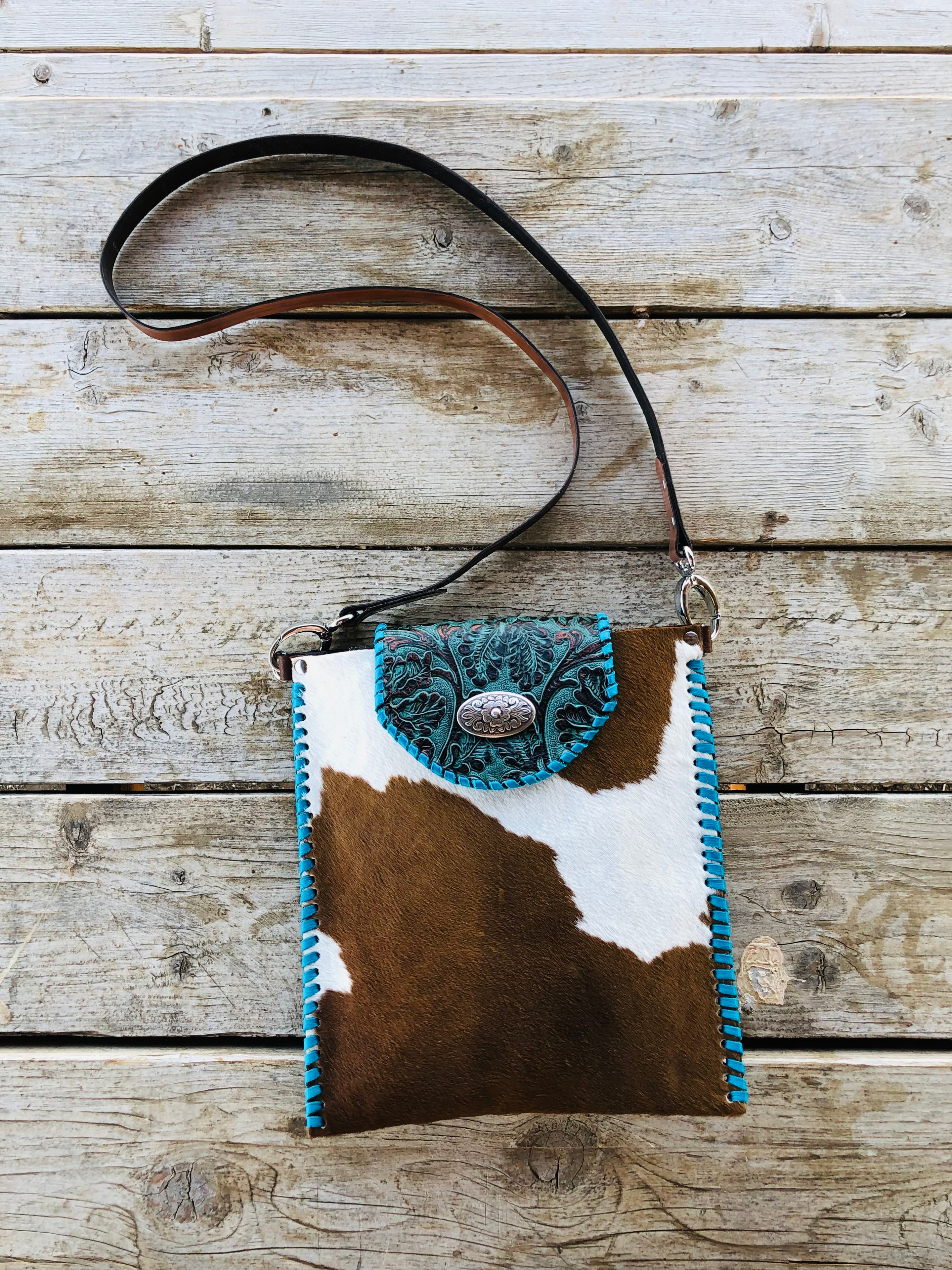 Speckled hair-on-hide crossbody bag with black fringe